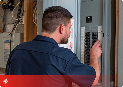 Electrical service call-to-action tile: a technician working at an open residential electrical panel